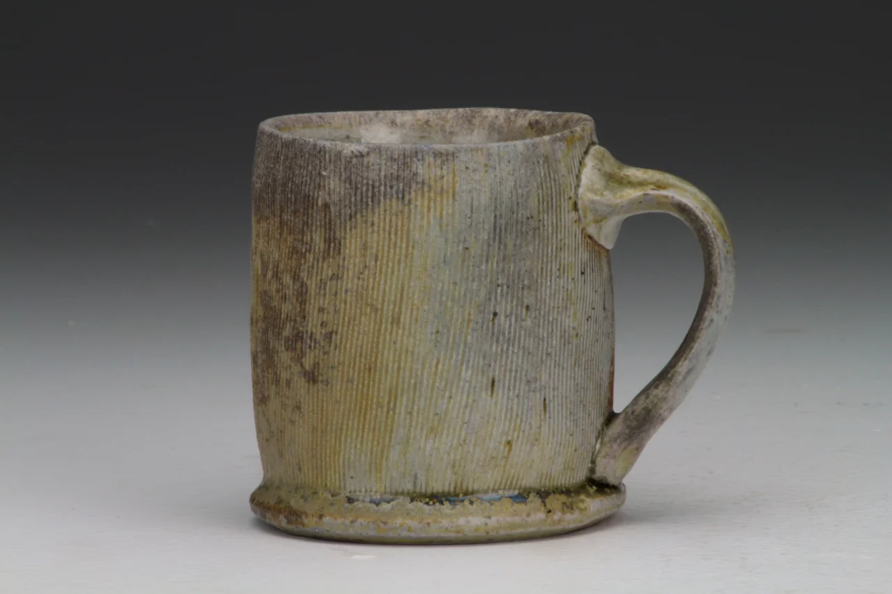 Coffee cup, 4" high, stoneware with local clay slip.