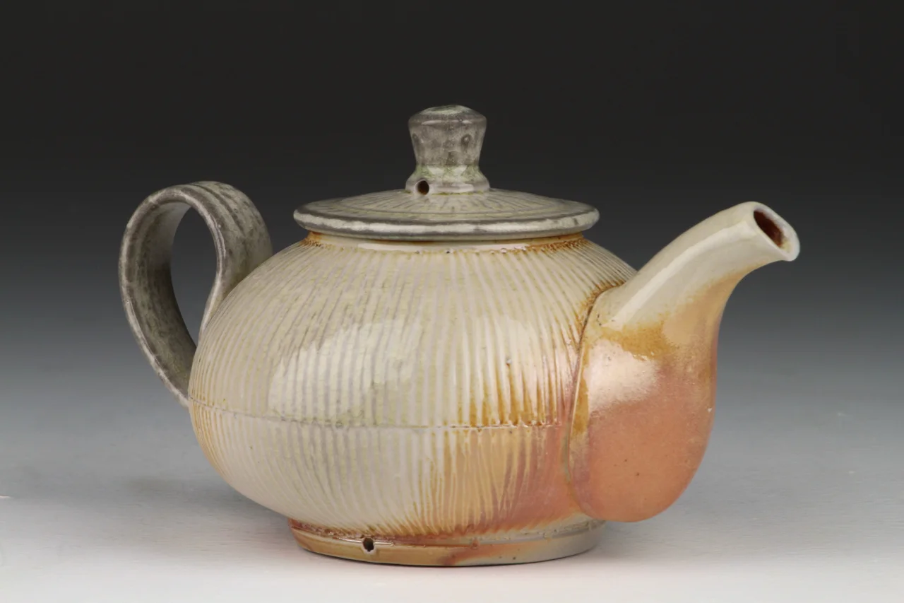Teapot, 4.5" high, porcelain, fired in the soda chamber.