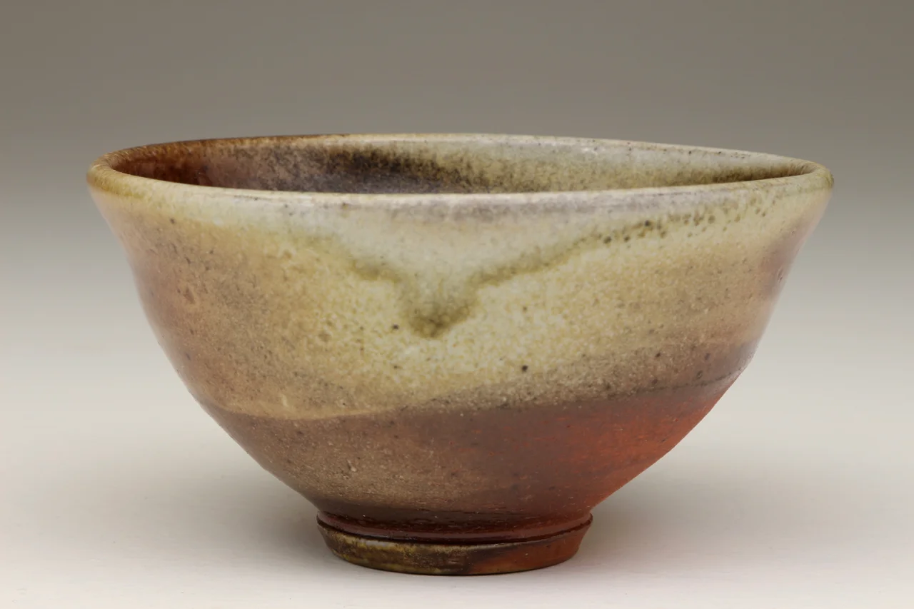 Small bowl, 4" wide, stoneware with flashing slip.