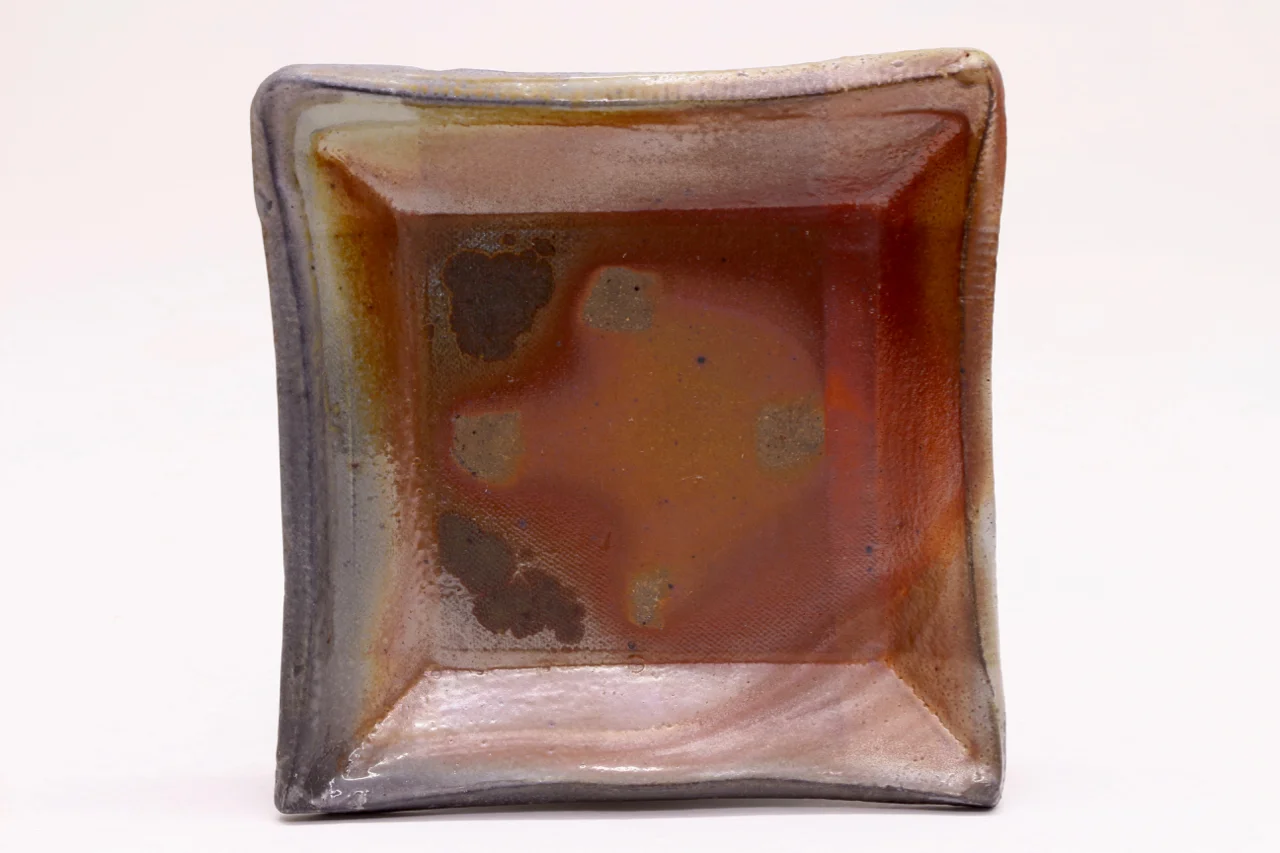 Square dish, 4", Stoneware with flashing slip.