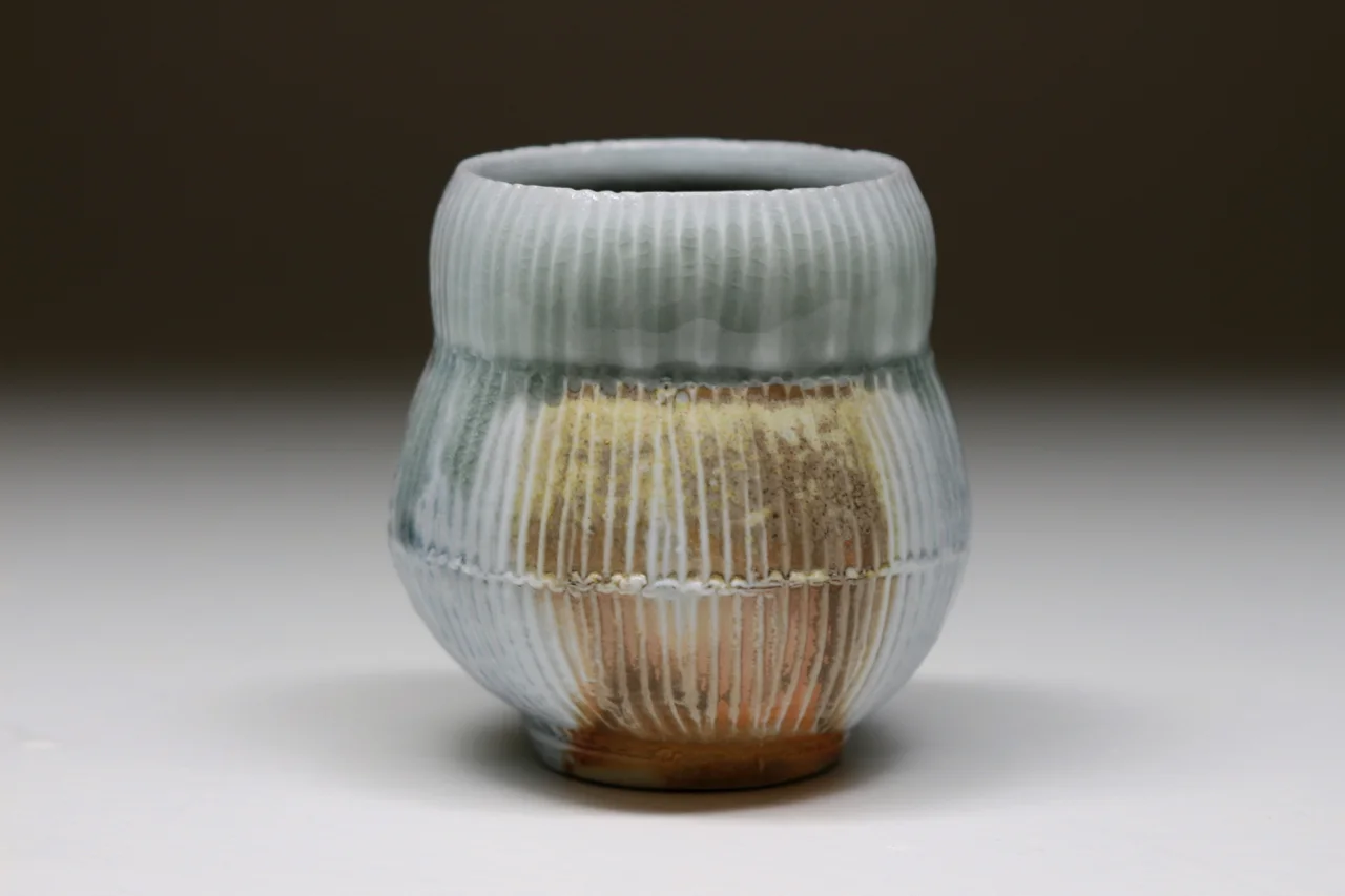 Yunomi, 4" high, glazed porcelain with flashing slip.