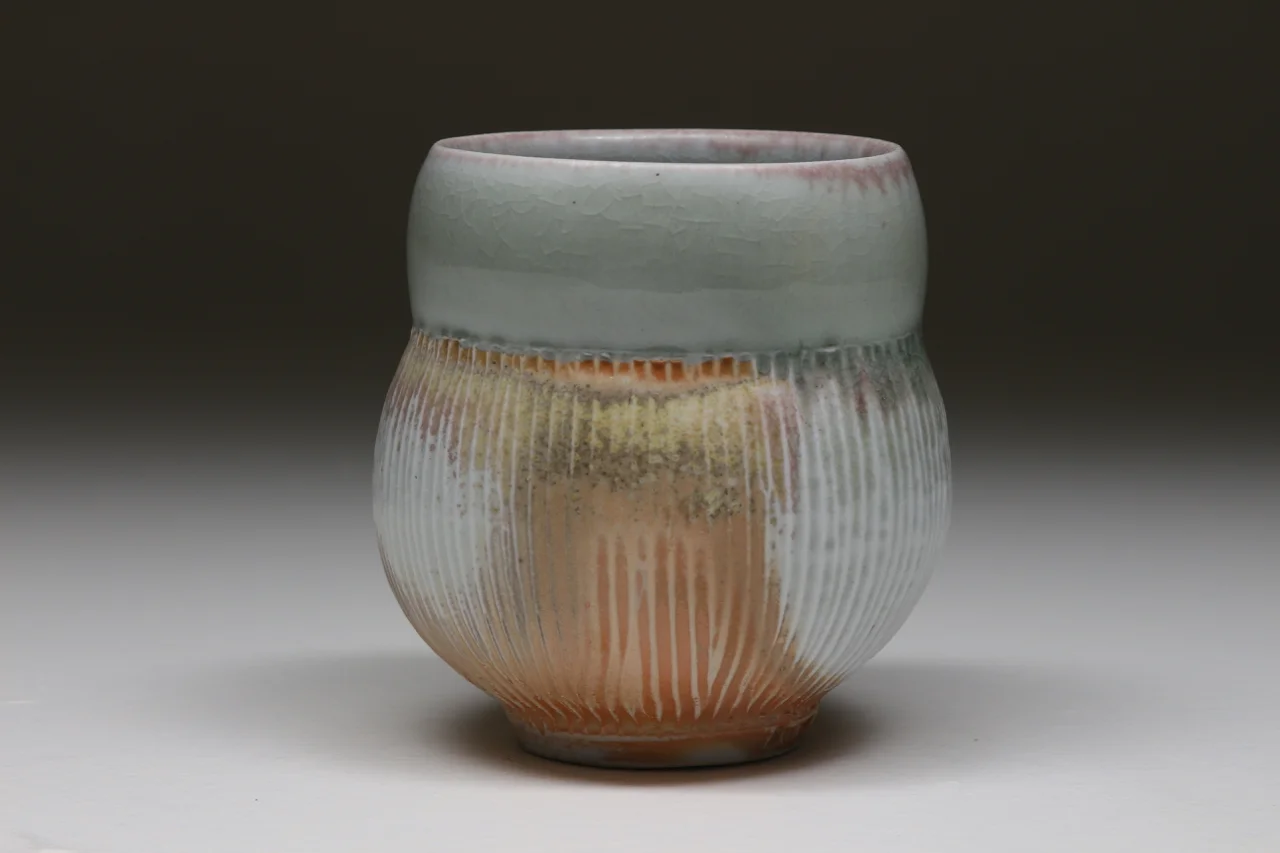 Yunomi, 4" high, glazed porcelain with flashing slip.