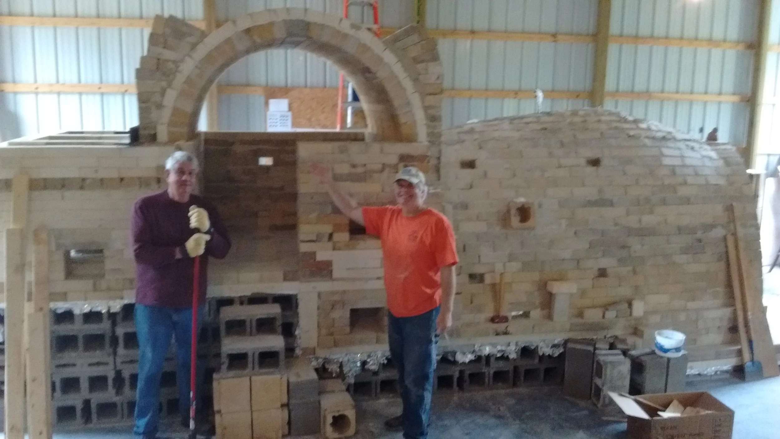 The arch is supported with buttresses and the form removed. Pat and Dan are pleased.