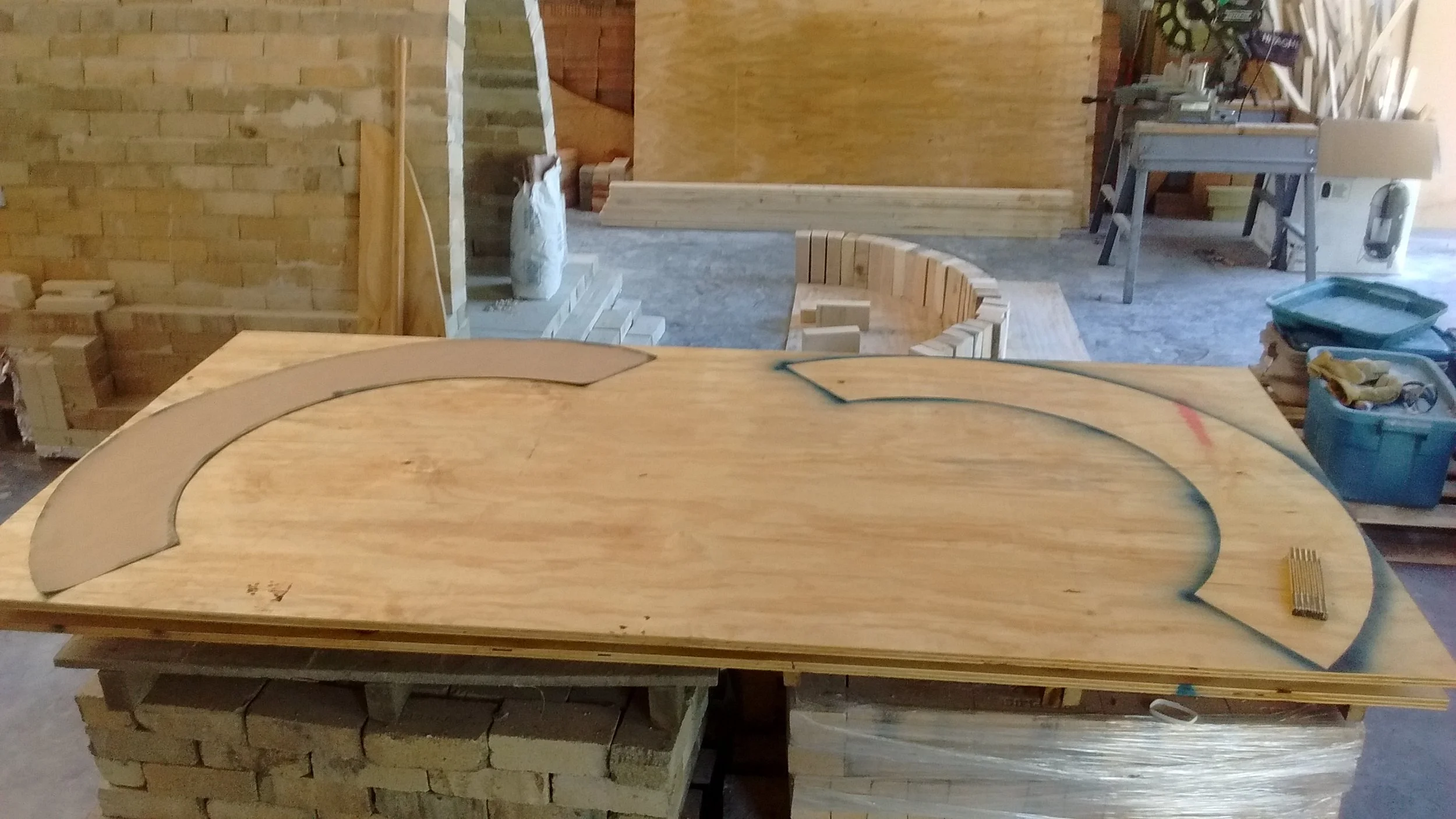 Transferring the arch pattern onto plywood to make ribs.