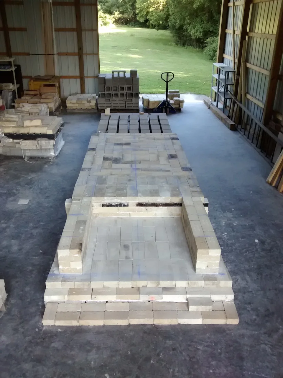 The floor of the first chamber and the lower walls of the firebox are complete. The floor for the second chamber will be laid later so we aren't walking all over it while we build the first chamber.