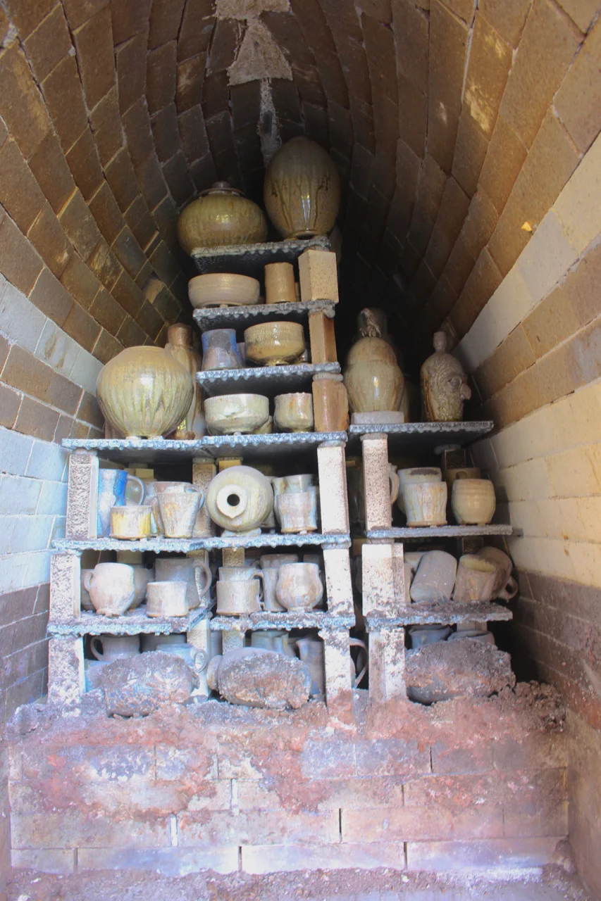 Front stack after the firing. Late ash on the lowest shelf of pots needed a lot of cleanup, but hid some amazing surfaces under it all. Next firing, we'll be sure to do a burn-down and bring up the temp at the end.