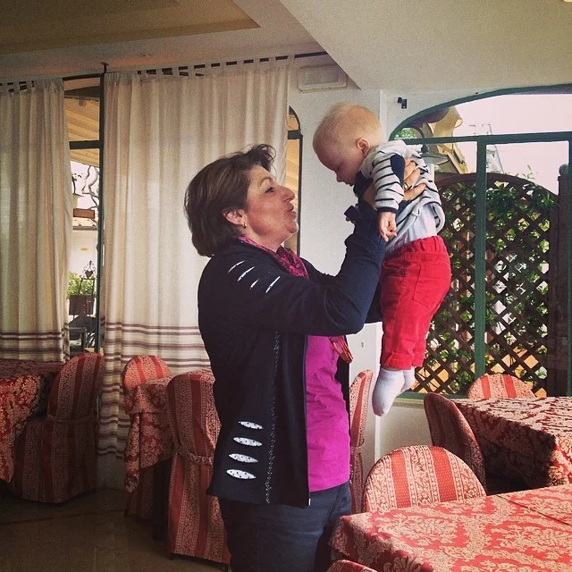 Samuel with one of his surrogate Italian nonnas. This woman whisked him away, fed him biscotti, took him for a walk and then gave us the best travel advice we received in Italy!