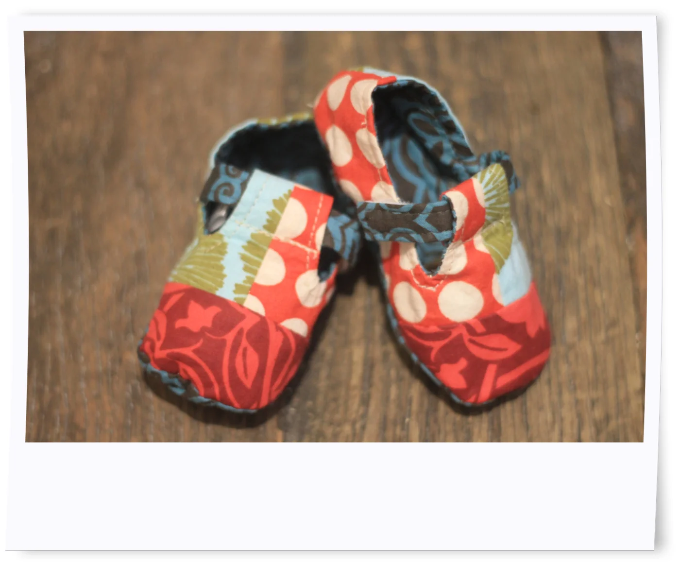 The retro patchwork baby booties in raspberry are currently available online for $24 and there is an adorable matching bib to complete the set.