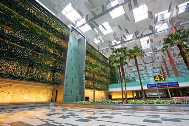 Feeling relaxed? Trees and plants dot the building inside Changi airport, which boasts a five-storey vertical garden with waterfalls. Image via Traveller