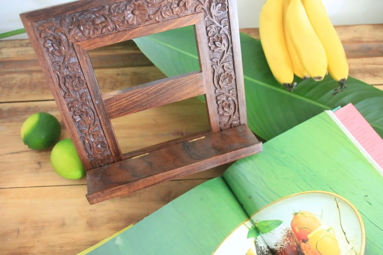 Our beautiful timber book stand is handcarved in sheesham wood by the artisans at Aspiration International in India