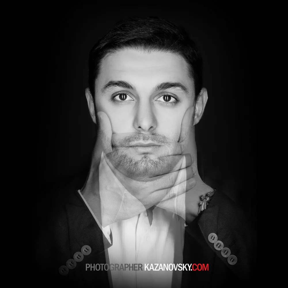 Black and white portrait of a young man with short dark hair, looking directly at the camera, with multiple overlapping images of his face creating a layered effect.