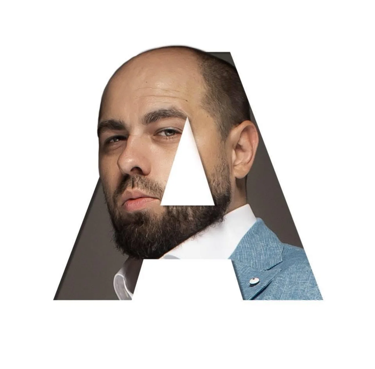 A photo of a man with a beard and serious expression, framed within a large letter 'A'. The man is dressed in a suit with a bow tie, and the background is plain.