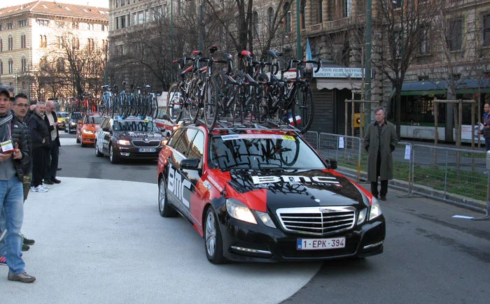 They’re Off! Team cars roll through Piazza Castello on their way to Sanremo
