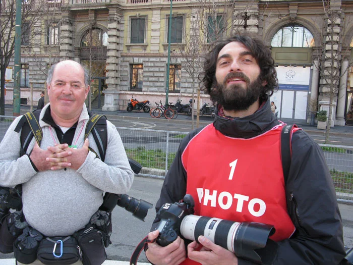 Top cycling photographers Graham Watson (L) andLuca Bettini (R) chill before the beginning of the race