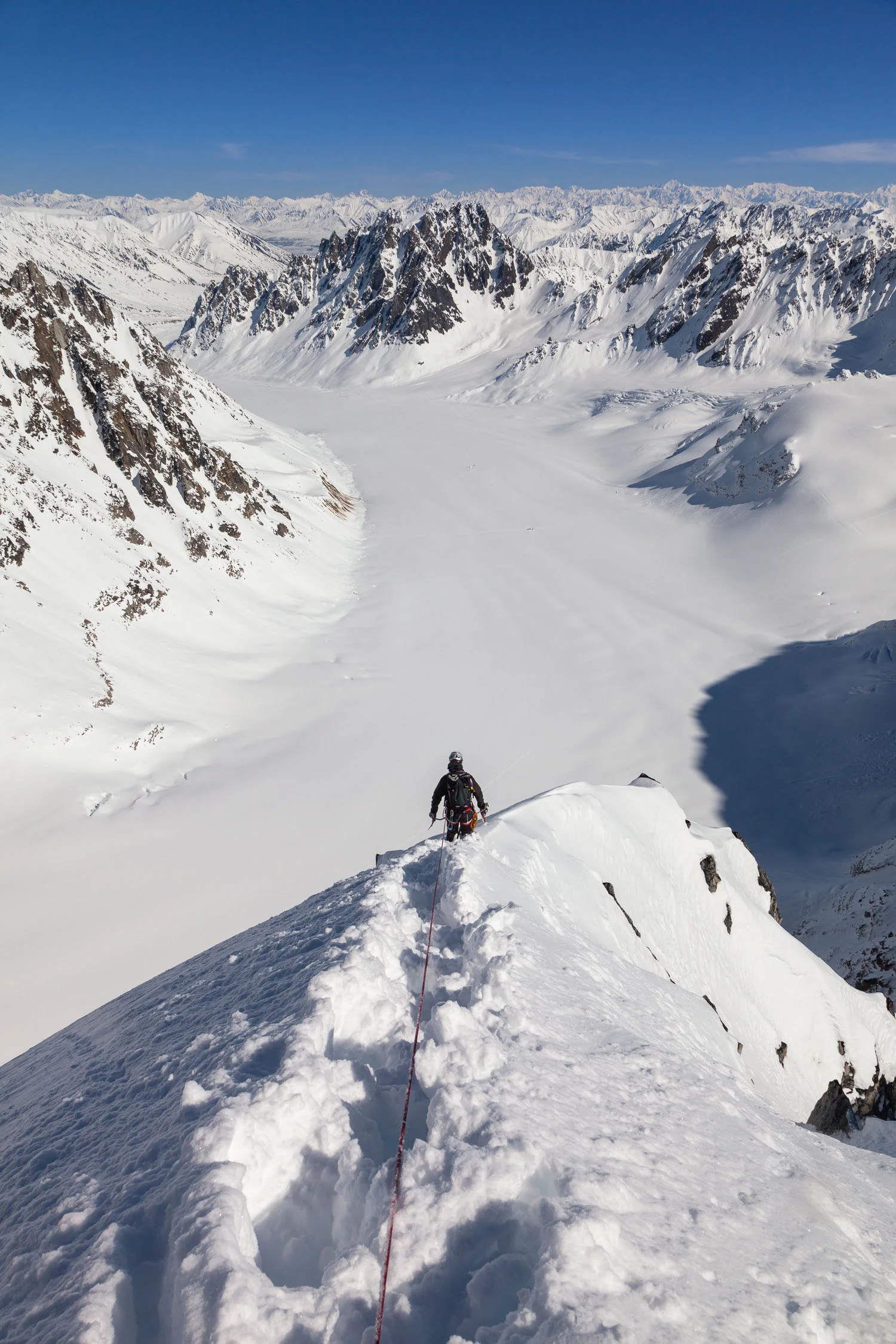 Looking for a way down after successful 1st ascent of a virgin peak, Revelation Mountains, Alaska