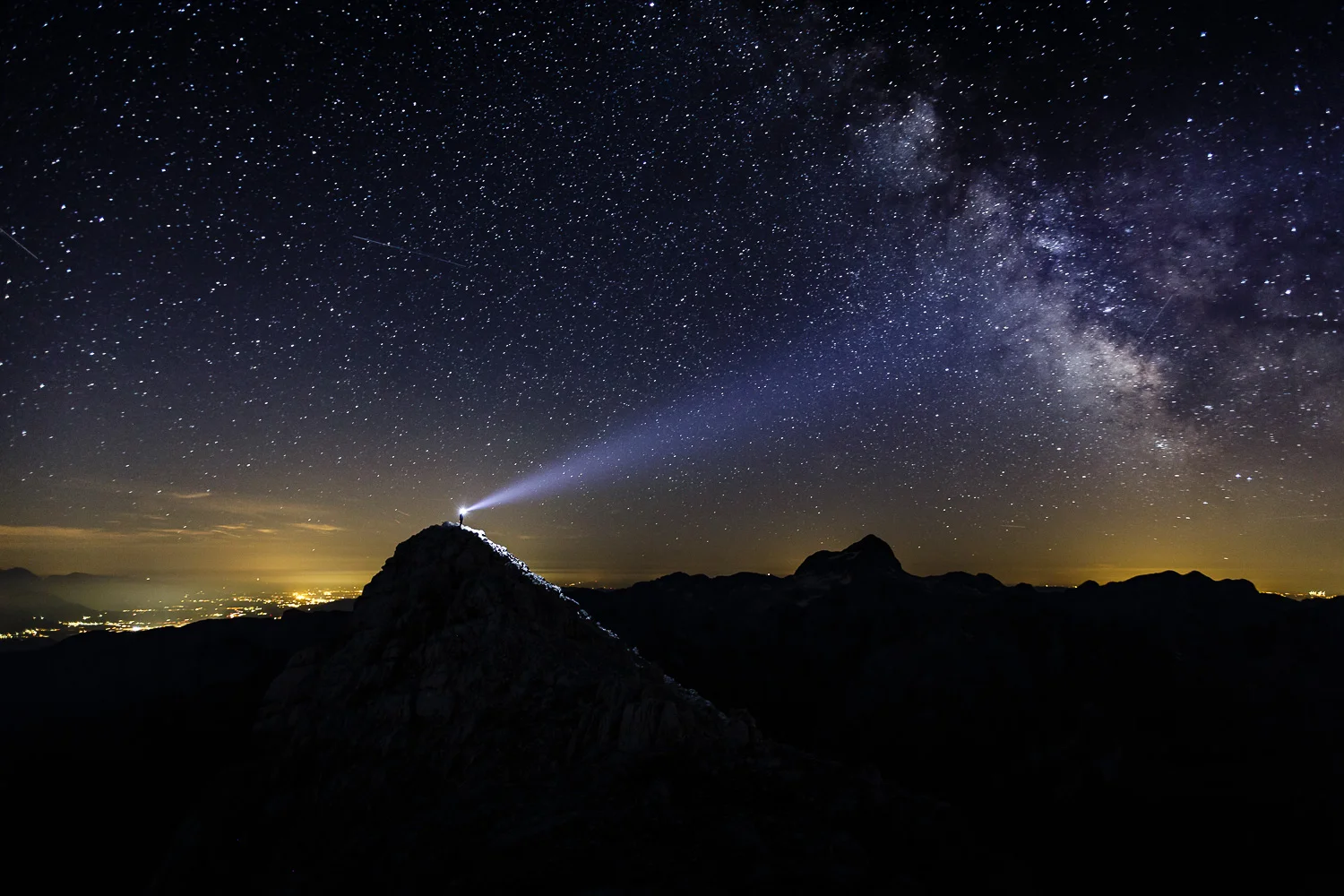 The beauty of the dark night sky lit with The Milky Way above Triglav - Slovenia's highest mountain!