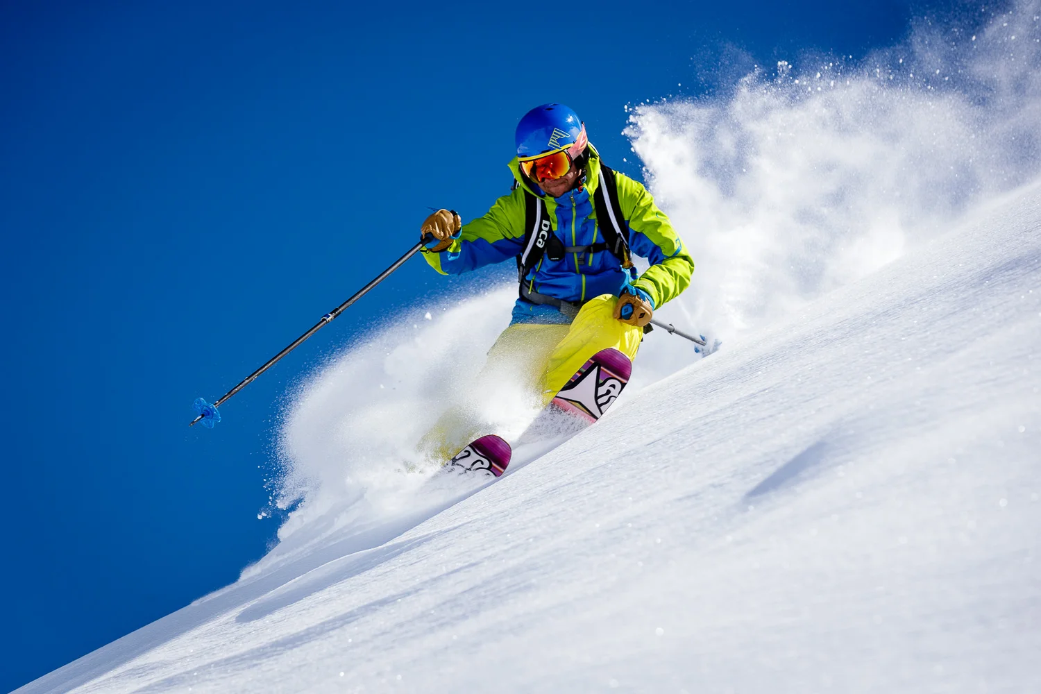 Freeride skiing in Austria on a perfect sunny powder day.
