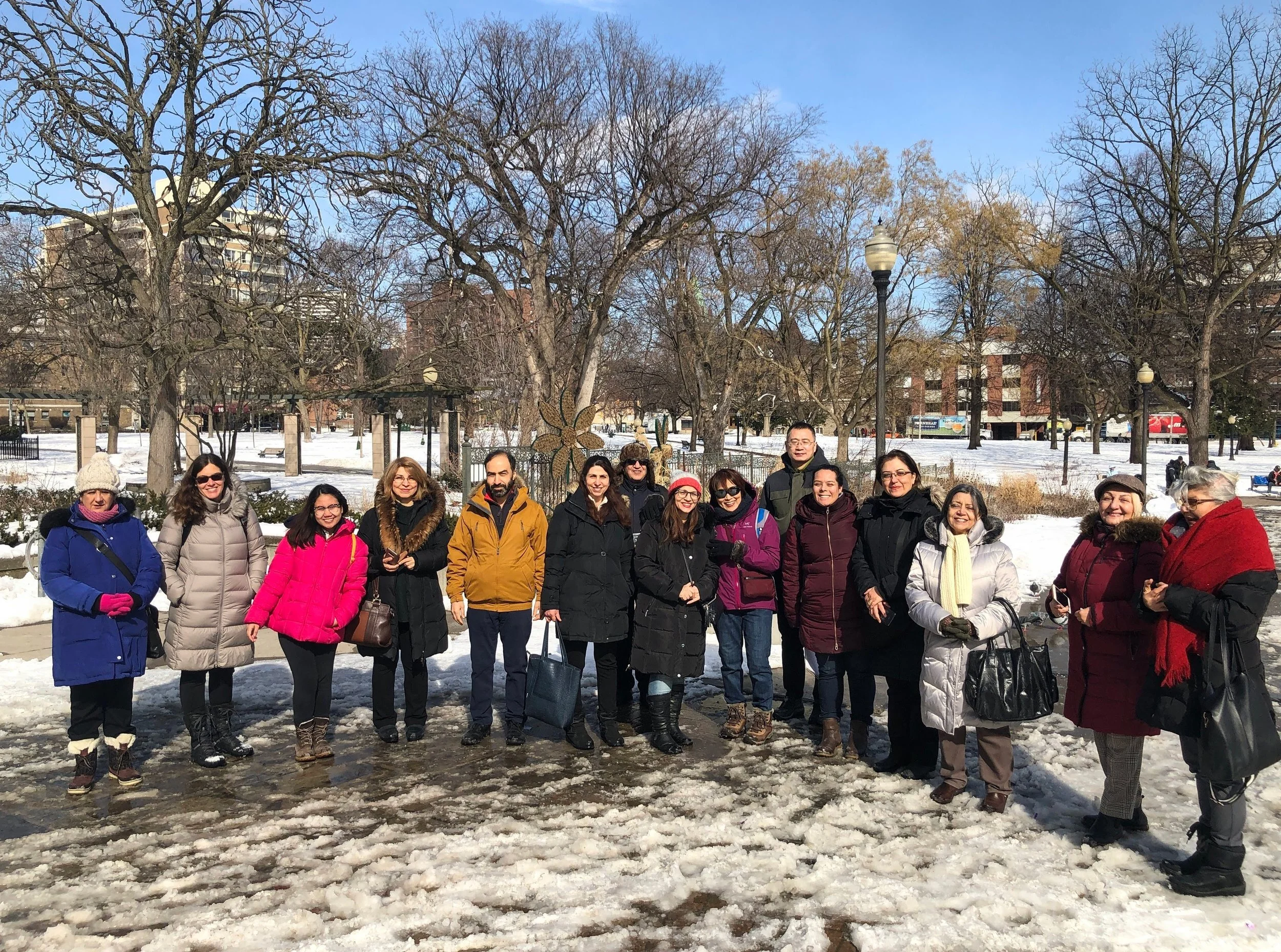 Group of adults standing in a semi circle.jpg