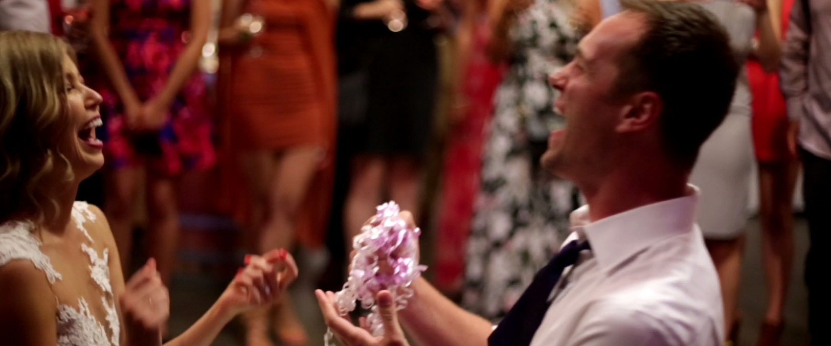 Stephanie may or may not have forgotten her garter, so Graham threw a bow from one of their wedding gifts instead. Guess what? It was hilarious, and nobody cared .