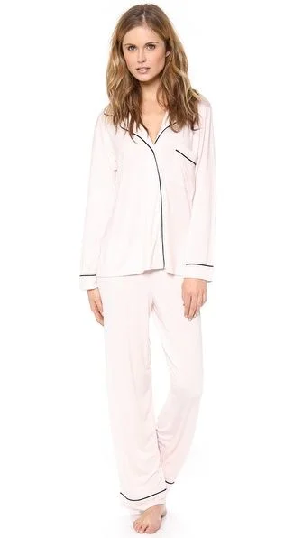 PJ set After packing your statement outfit(s) for Christmas Eve mass and/or family party, all you really need are "slug" (think about it) clothes for lounging. Keep it simple and chill by reverting to childhood and staying in your PJs all day!