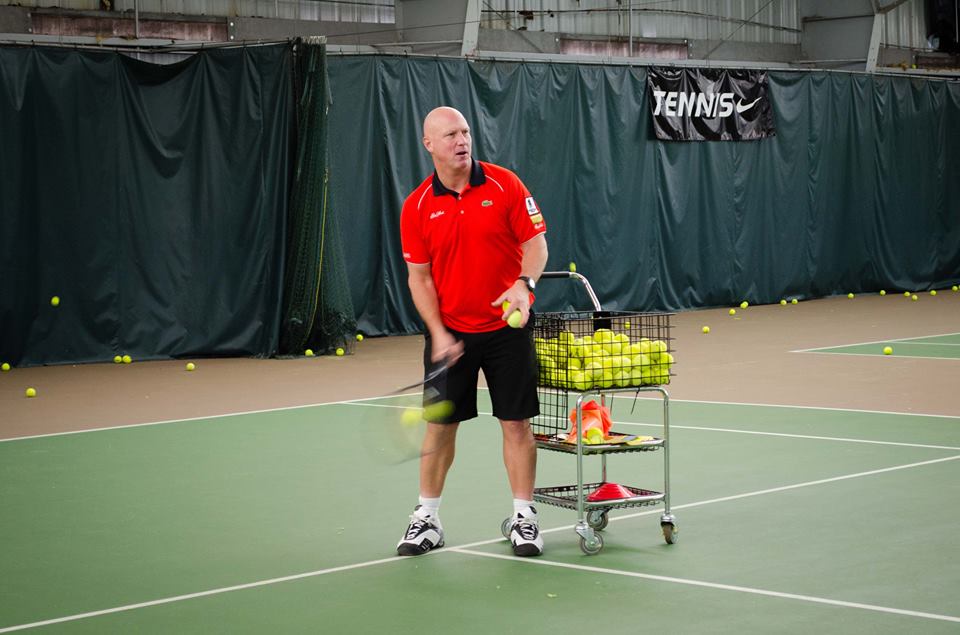 "Dual-Hand Luke" feeds tennis balls to the players during the clinics.