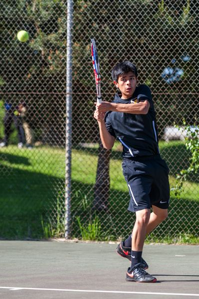 TRIBUNE PHOTO: DIEGO G. DIAZ - Freshman Miguel Diaz-DeLeon of Roosevelt High returns a shot in a Portland Interscholastic League home match last week against Franklin.