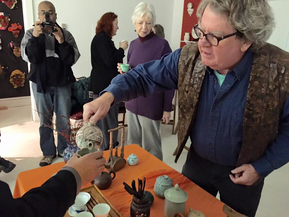 Jimmy Clark serves tea during the Tea Ceremony at the gallery.