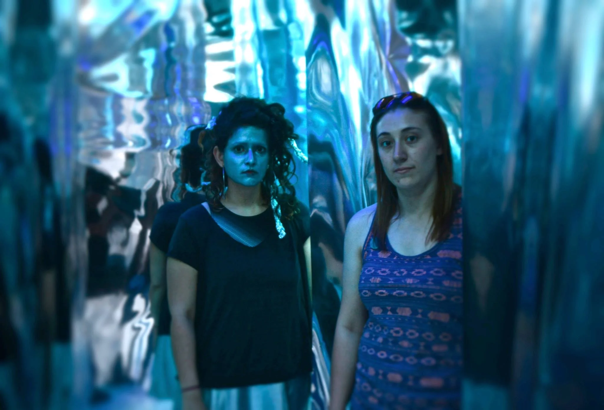 Paige Miller (right and Ashley Carrega transform the gallery one more time. &nbsp;(Photo by Gary Reed)