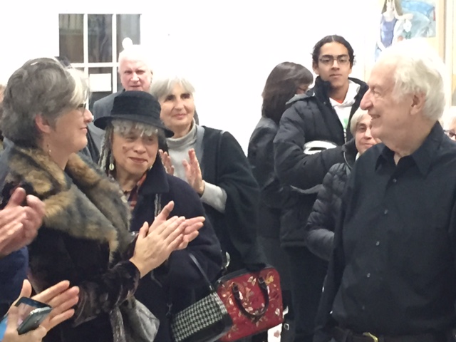 Robert (right) is cheered by the guests during his opening reception.