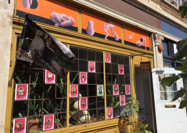 "Sign/Society" by James Tafel Shuster (painting on frieze), "Recurring Circles" by Michael Koehler (photograph on flag) and "Love is the Message" by Jamel Shabazz (portraits on window)