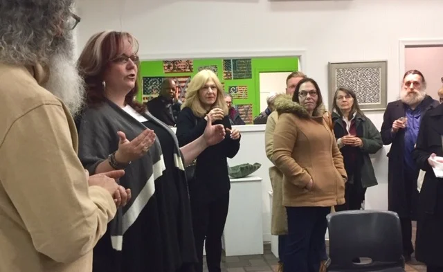 Center in The Park’s Executive Director Renée C. Cunningham (second from left) addresses the visitors on opening night.