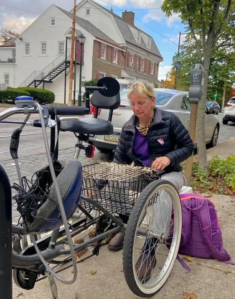 Fiber artist Kathryn Pannepacker weaving on her improvised tricycle loom. Photo by Gary Reed