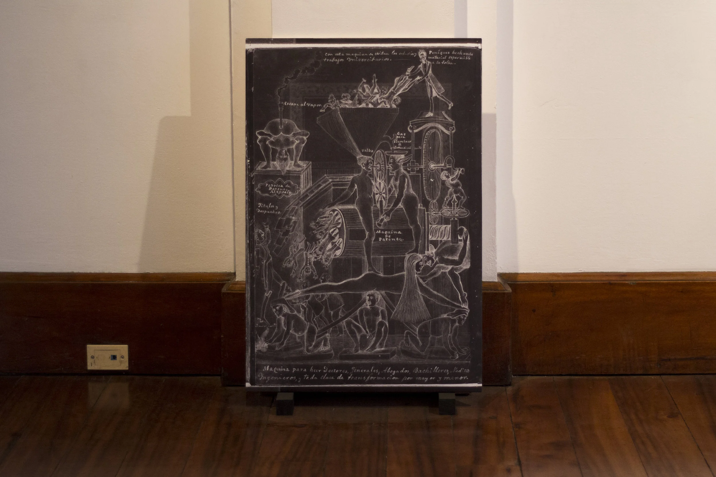 Image in El cuaderno rojo. Property of Archivo Nacional de Costa Rica. Installation View, Alianza Francesa, Costa Rica. The top of the image reads: “With this machine work and university studies are avoided”. Image Verónica Alfaro. 2017