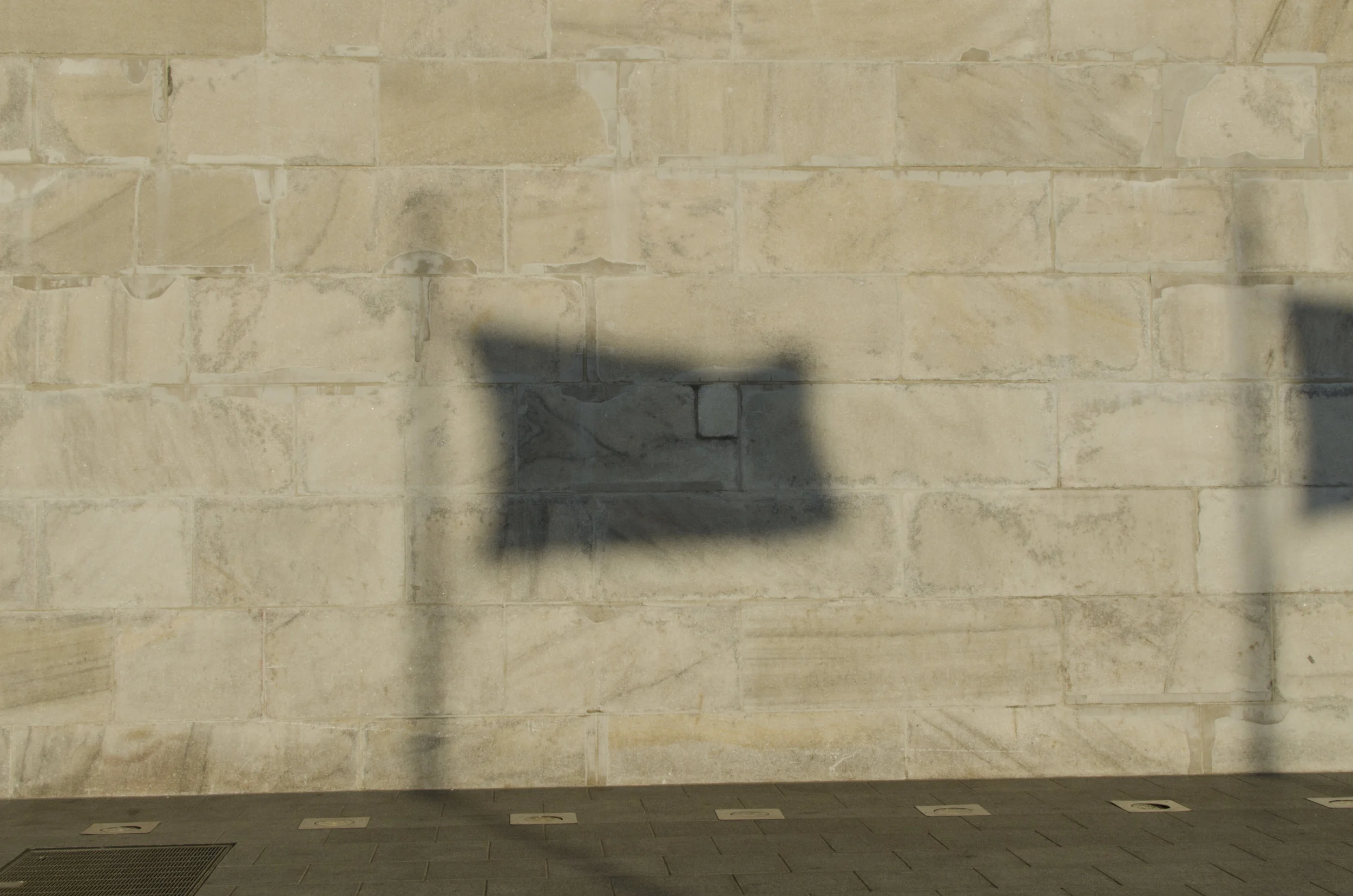  A shadow from an American flag is cast on to the base of the Washington monument. The monument is run by the National Parks service, along with several other monuments in the D.C. area. 