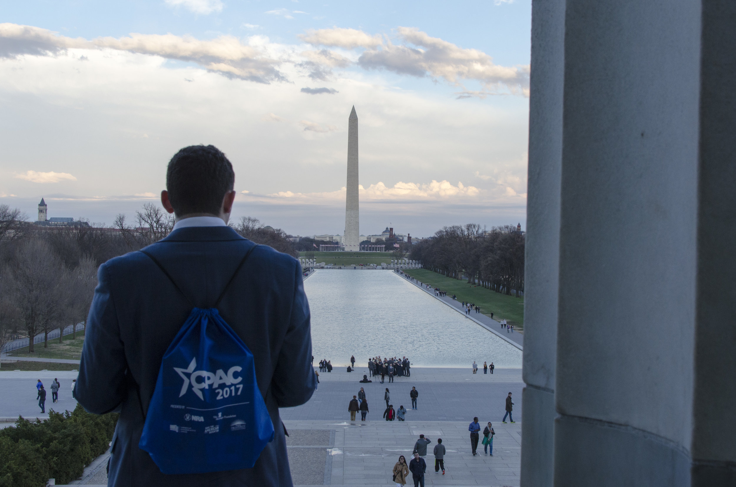  A man wearing a CPAC backpack looks at the Washington monument from the Lincoln memorial. CPAC is the Conservative Political Action Conference, President Trump gave a speech at the conference on Friday February 24.&nbsp; 