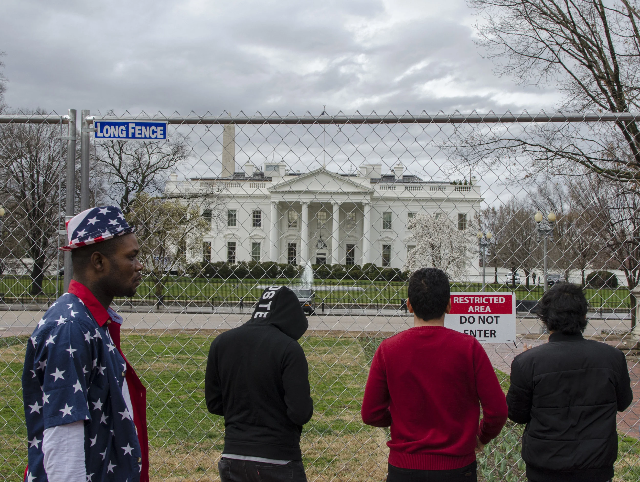  A tall construction fence blocks visitors view of the White House. One of Donald Trumps campaign promises while running for the presidency was to build a border wall. 
