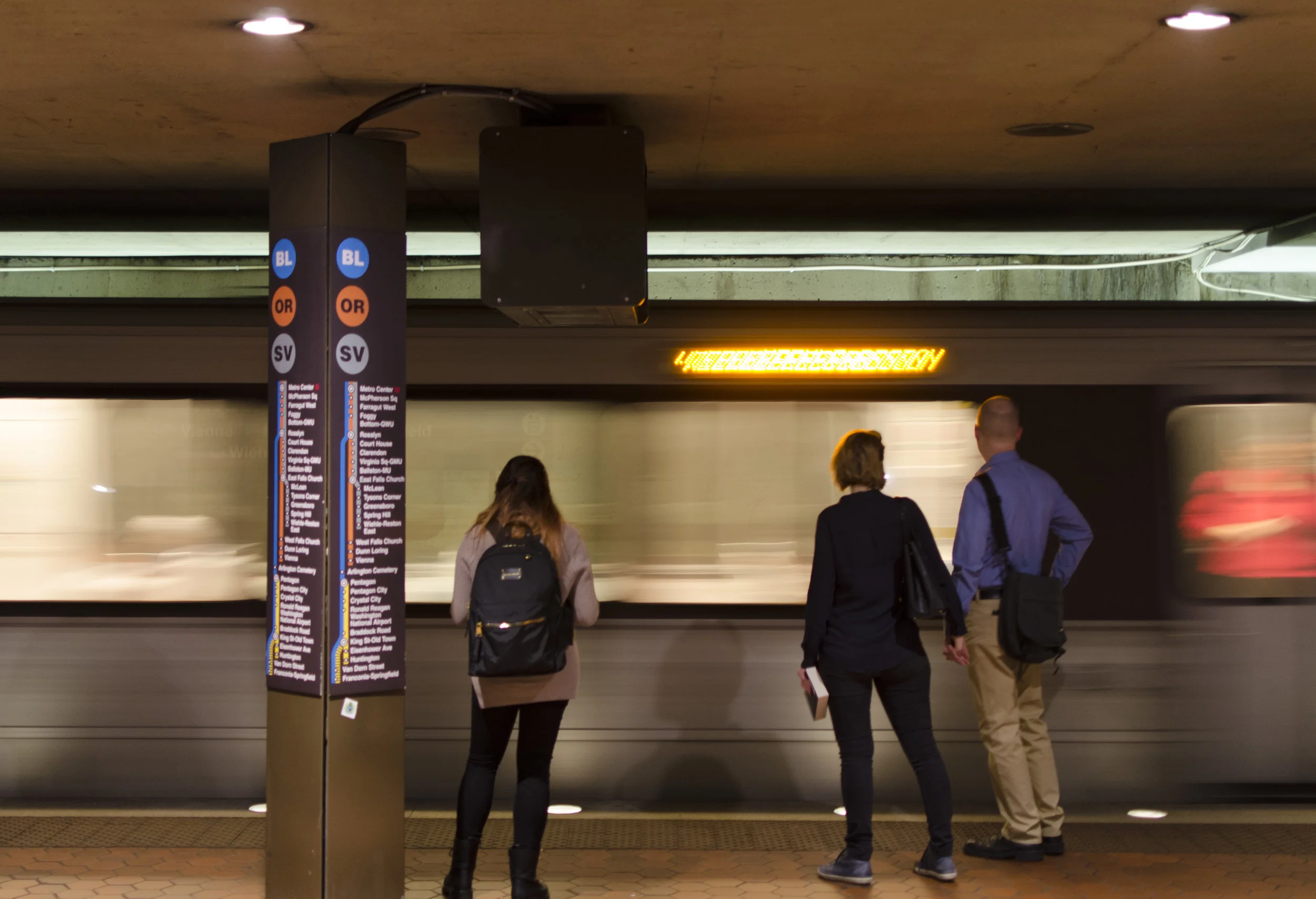  People wait for the metro in Washington D.C., the metro is how many people commute within the Washinginton metropolitan area. 