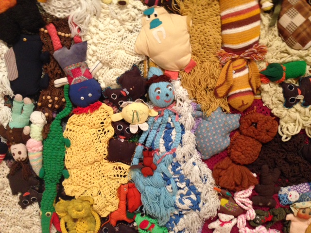 Mike Kelley, More Love Hours Than Can Ever Be Repaid and The Wages of Sin (detail), 1987 Stuffed fabric toys and afghans on canvas with dried corn; wax candles on base of wood and metal, Overall 120 3/4 x 151 3/4 x 31 3/4 inches