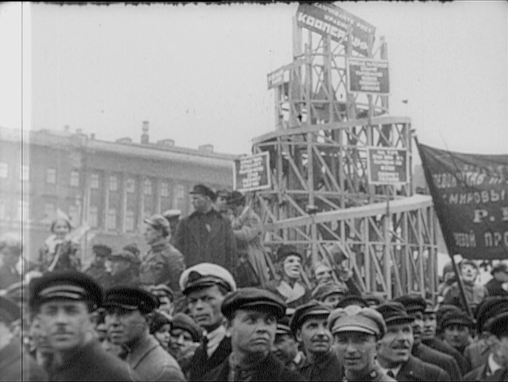 From newsreel footage of a Soviet parade, with a wooden model of Vladimir Tatlin's Monument to the Third International (1919-20)