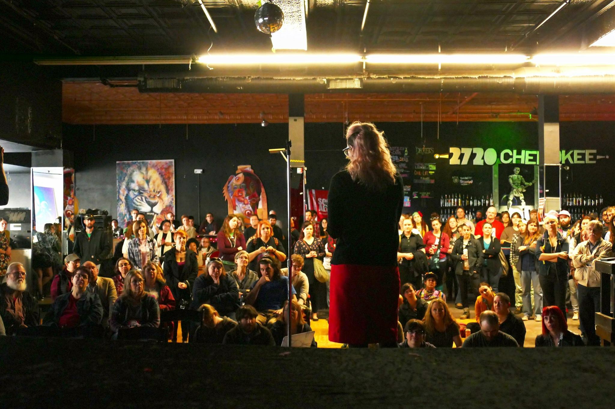 Stephanie Dinges speaking at a "mass meeting" organized by St. Louis Socialist Alternative to discuss resistance to the Trump administration. Photo by Richard Reilly.