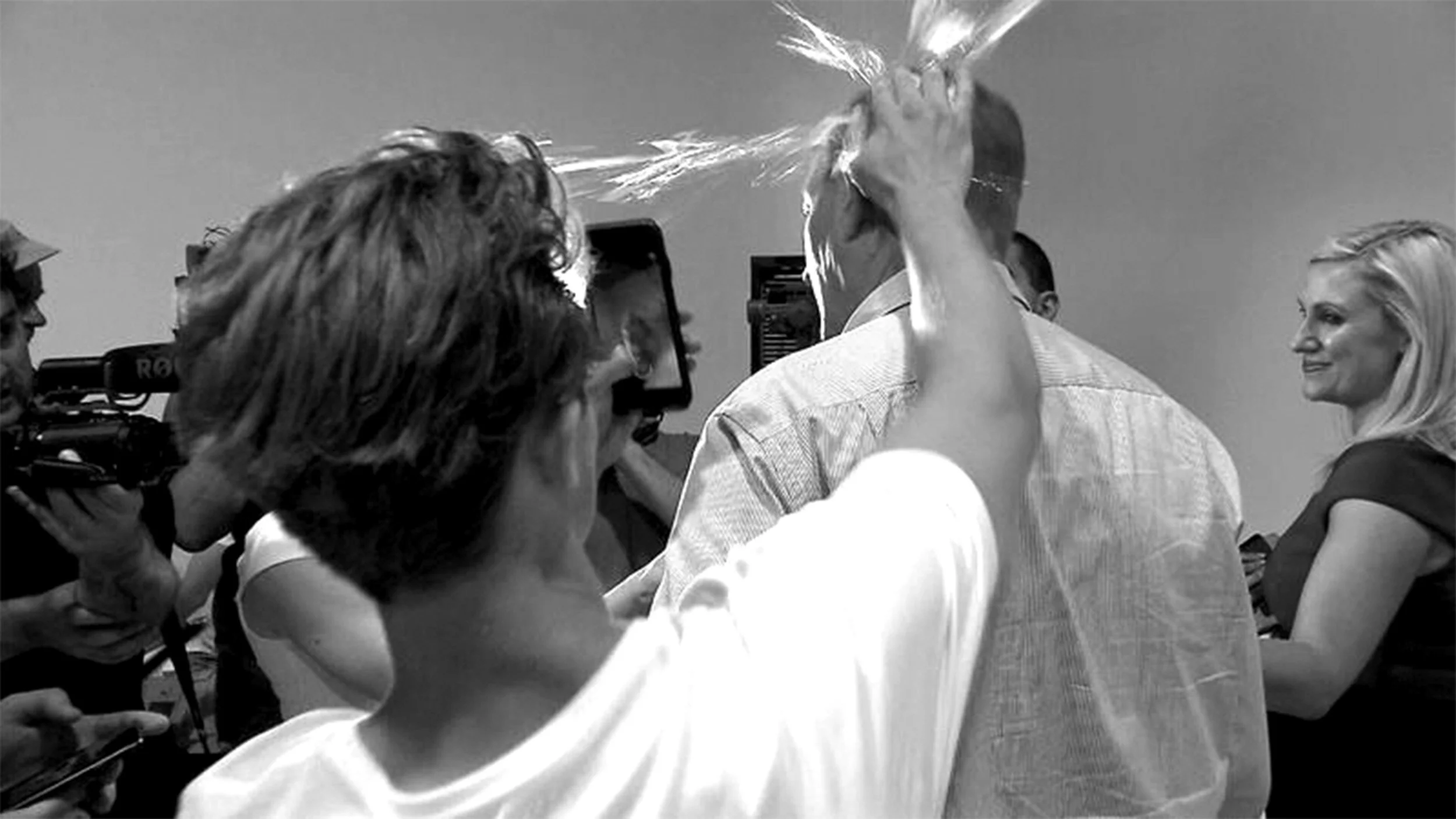 Will Connolly smashes an egg against the head of racist politician Fraser Anning.