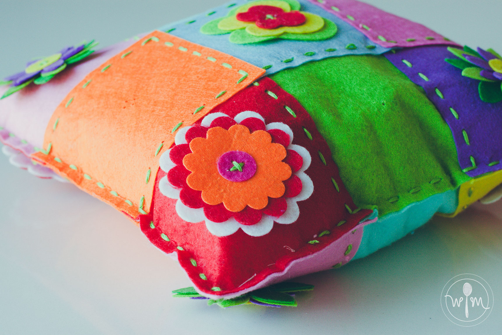 Here's Hermione's finished splicing cushion. She simply calls it a colorful pillow.