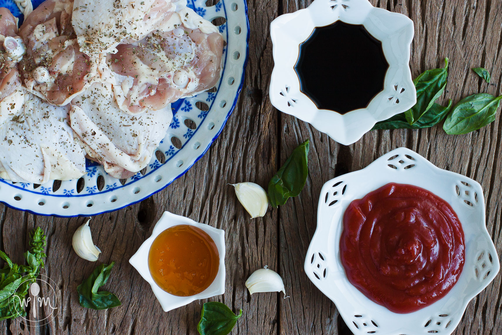 Ingredients: (clockwise from left) Chicken pieces, soy sauce, tomato sauce, garlic cloves, honey and basil, and (not shown) vinegar