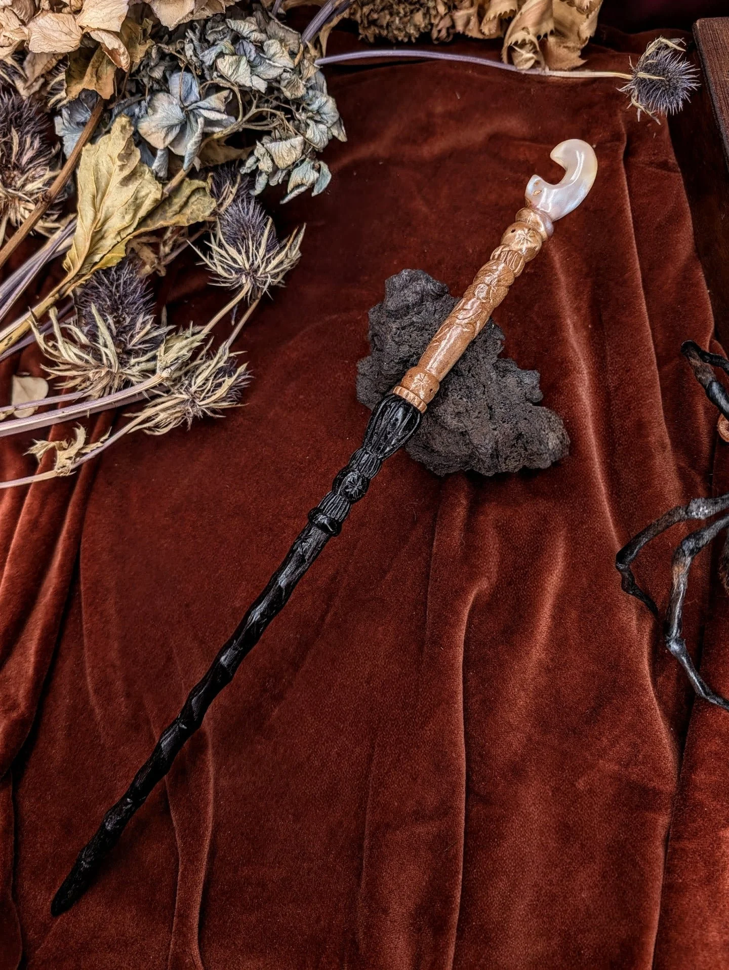 Entirely hand-turned and hand-carved from gorgeous woods, this Treasure Wand is an ode to the poesy of nature. Beneath the moonlight of a gothic garden, vines and branches twist and crack in the night wind. Hidden among the leaves, a small jay dreams
