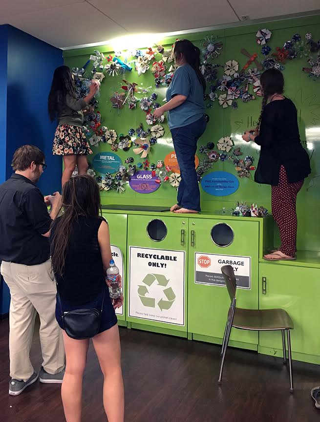 As the installation progressed, the swirling patterns began to emerge and take shape. Pictured: foreground - Michael McCarthy, Nicole Nielsen, 3D students - above lt to rt - Brigette Pina Sustainability Club member, Noa Paden 3D student, and Amber Bingham, Sustainability Club member
