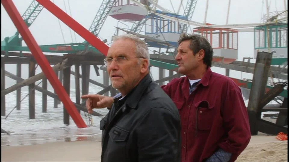 Greg mesanko and Jim Purpuri survey the damage the day after Hurricane Sandy.
