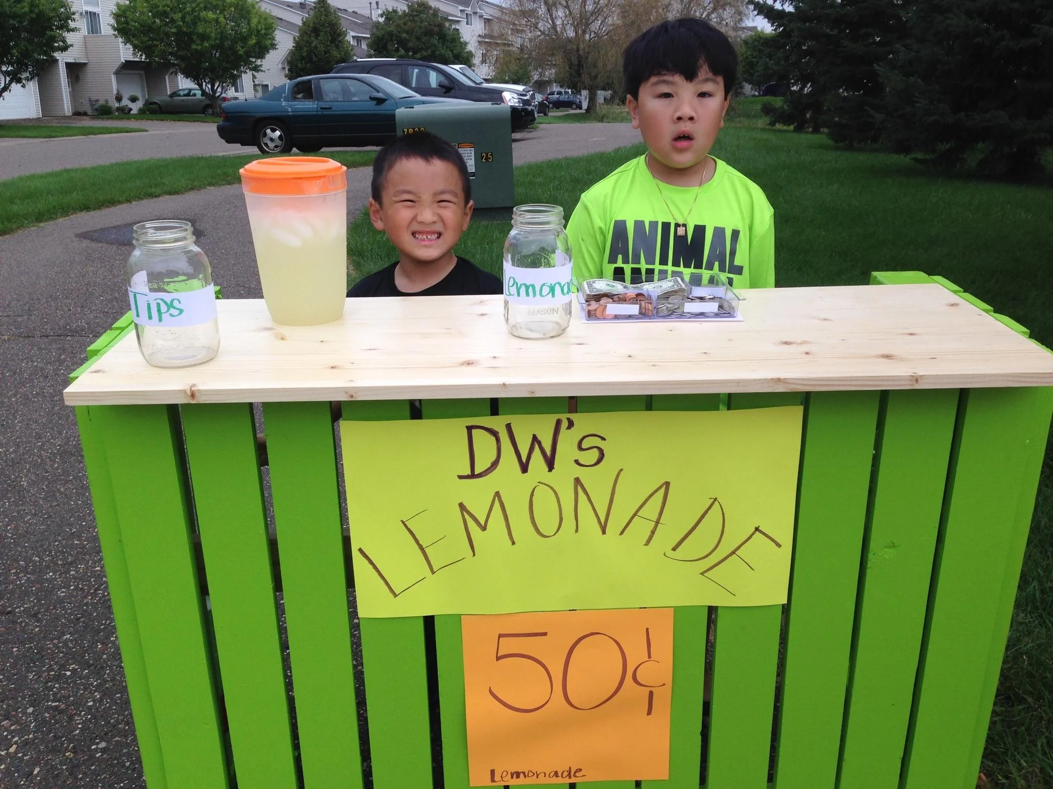 Zong's two business-minded sons celebrating the final days of summer with a lemonade stand.