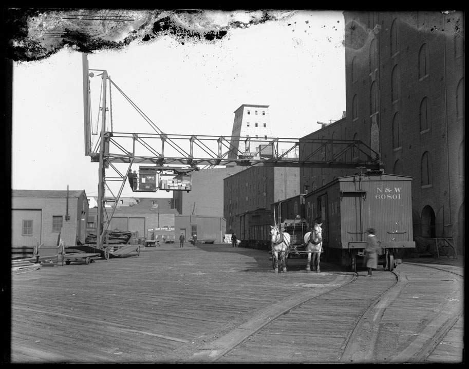 Bush Terminal Transfer, Hoisting Crane - N.S. & W. Railroad Car, horse team ("Cotton Rags" on wagon), 1912. NYC Municipal Archives.