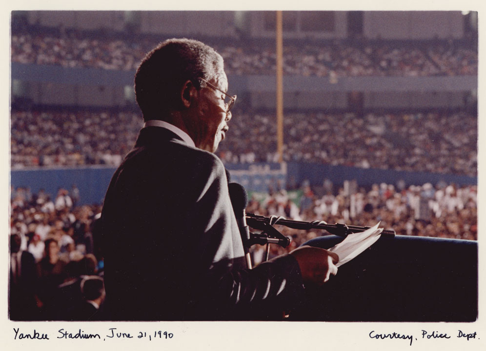 Nelson Mandela calls for an end to apartheid before a sold-out crowd at Yankee Stadium, June 21, 1990. Mayor David N. Dinkins Photograph Collection, NYC Municipal Archives.