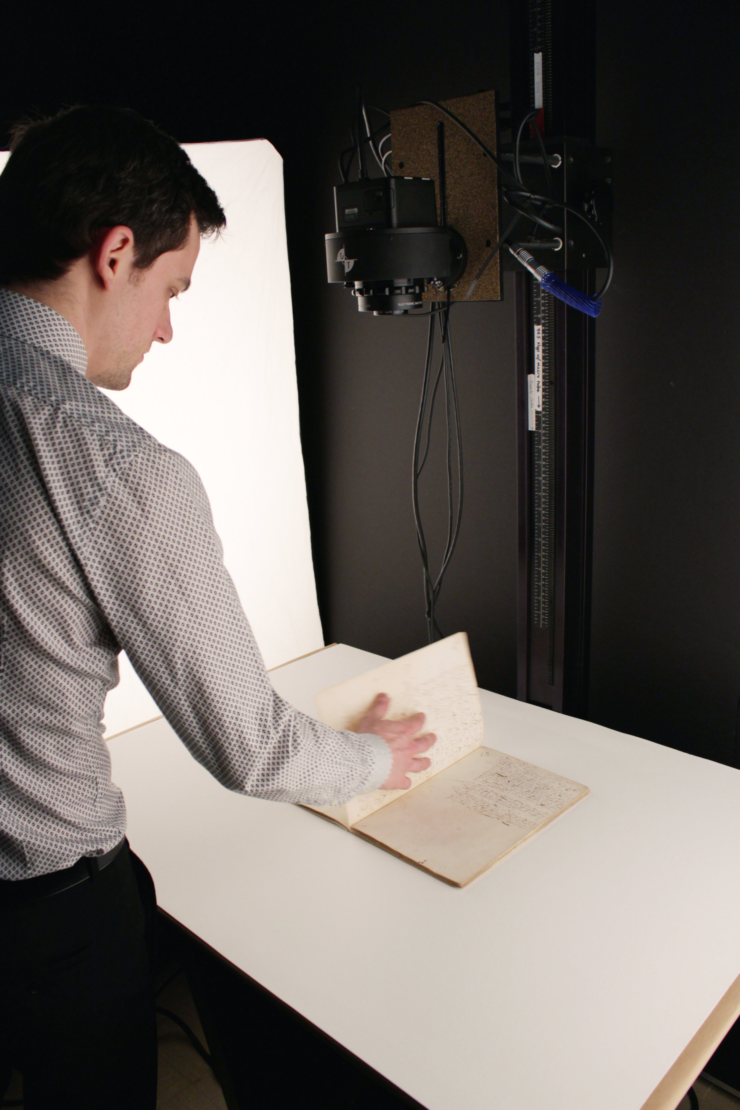 Digitizing colonial records using an 80-megapixel overhead camera system.